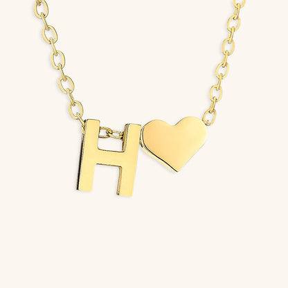navnesmykke med initialen Ria | 18k Guld