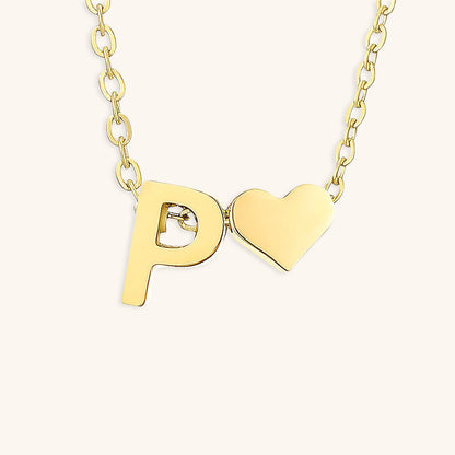 navnesmykke med initialen Ria | 18k Guld