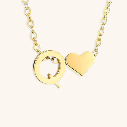 navnesmykke med initialen Ria | 18k Guld